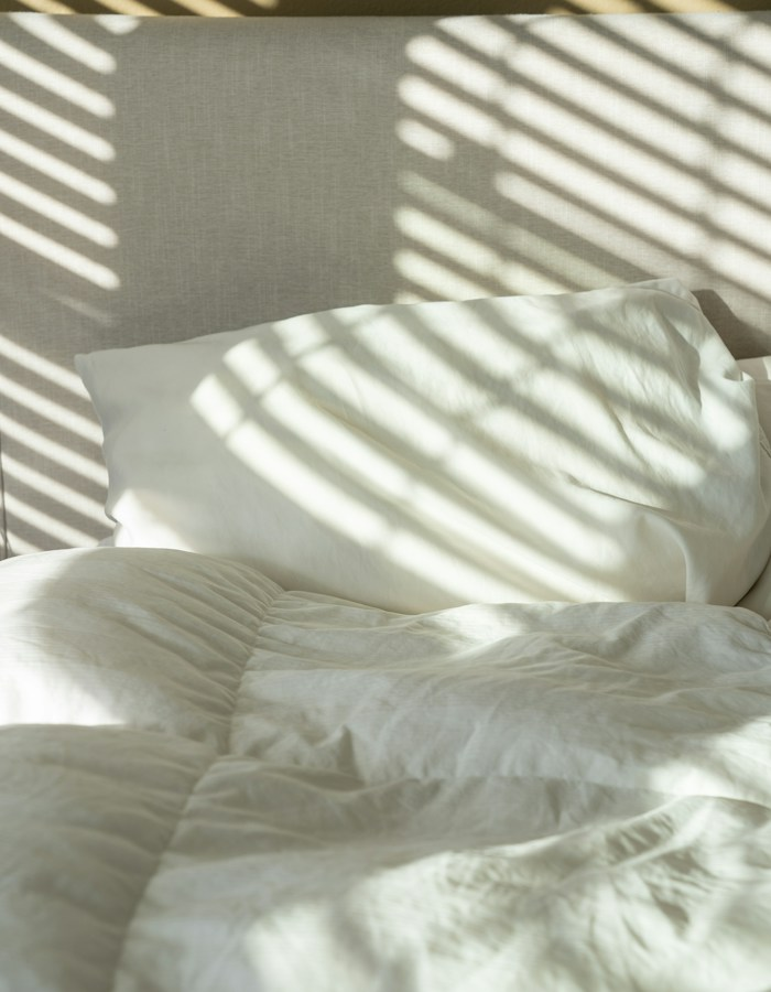 Minimal bedroom with white linen